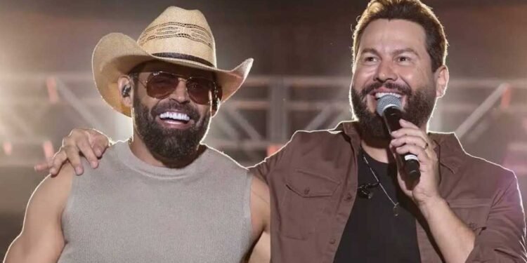 Diego & Arnaldo durante apresentação sertaneja em palco montado para gravação de DVD em Rio Preto.